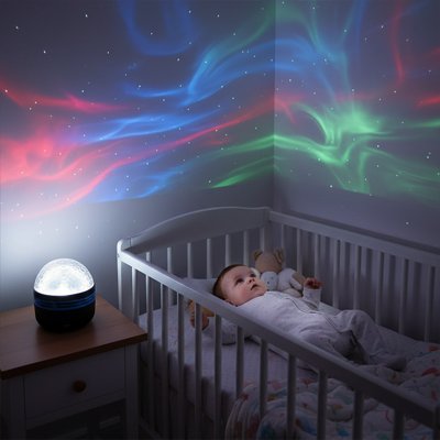 Veilleuse projection bébé regarde les étoiles